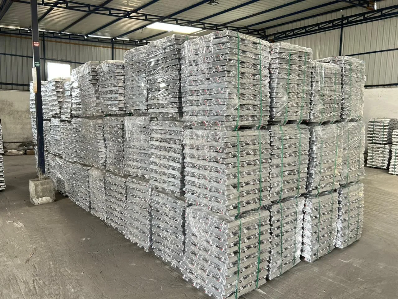 Stacked aluminium alloy ingots in the warehouse